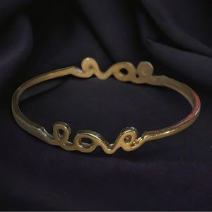 Gold tone cursive love bangle bracelet